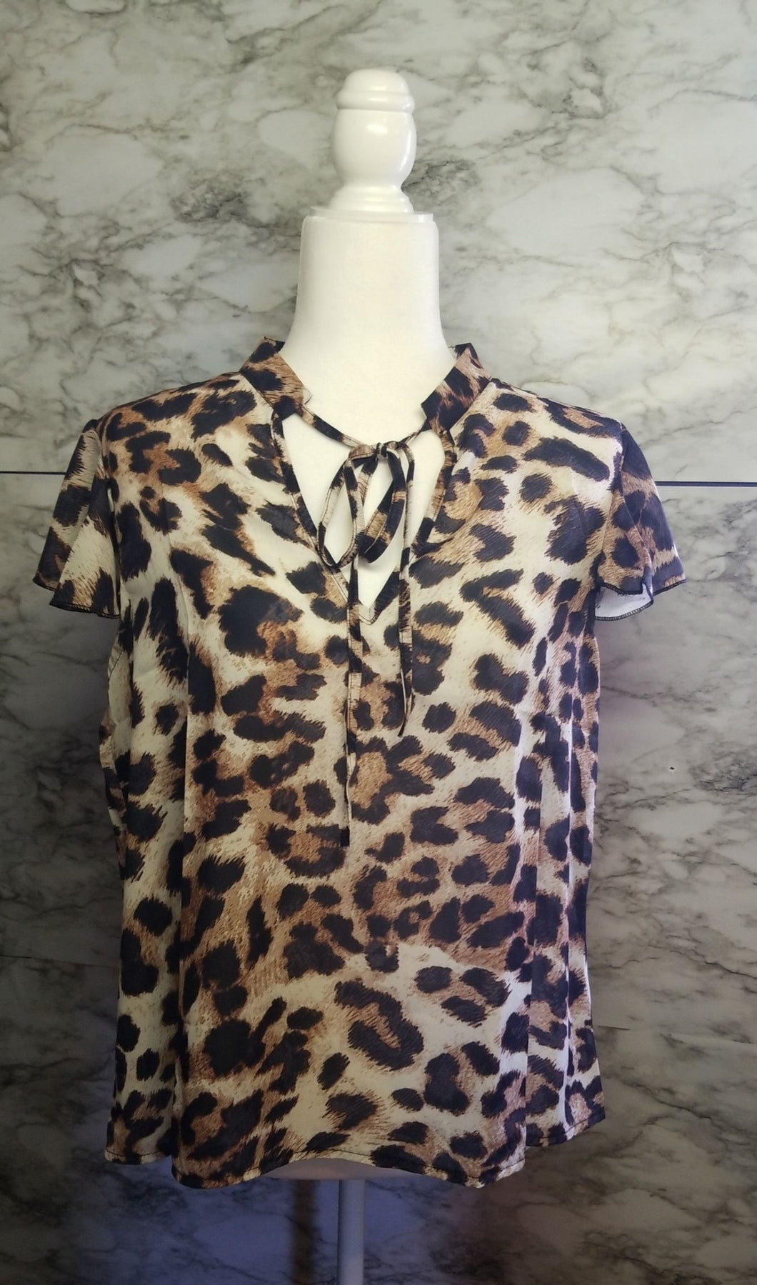 Cheetah print ruffle trim top